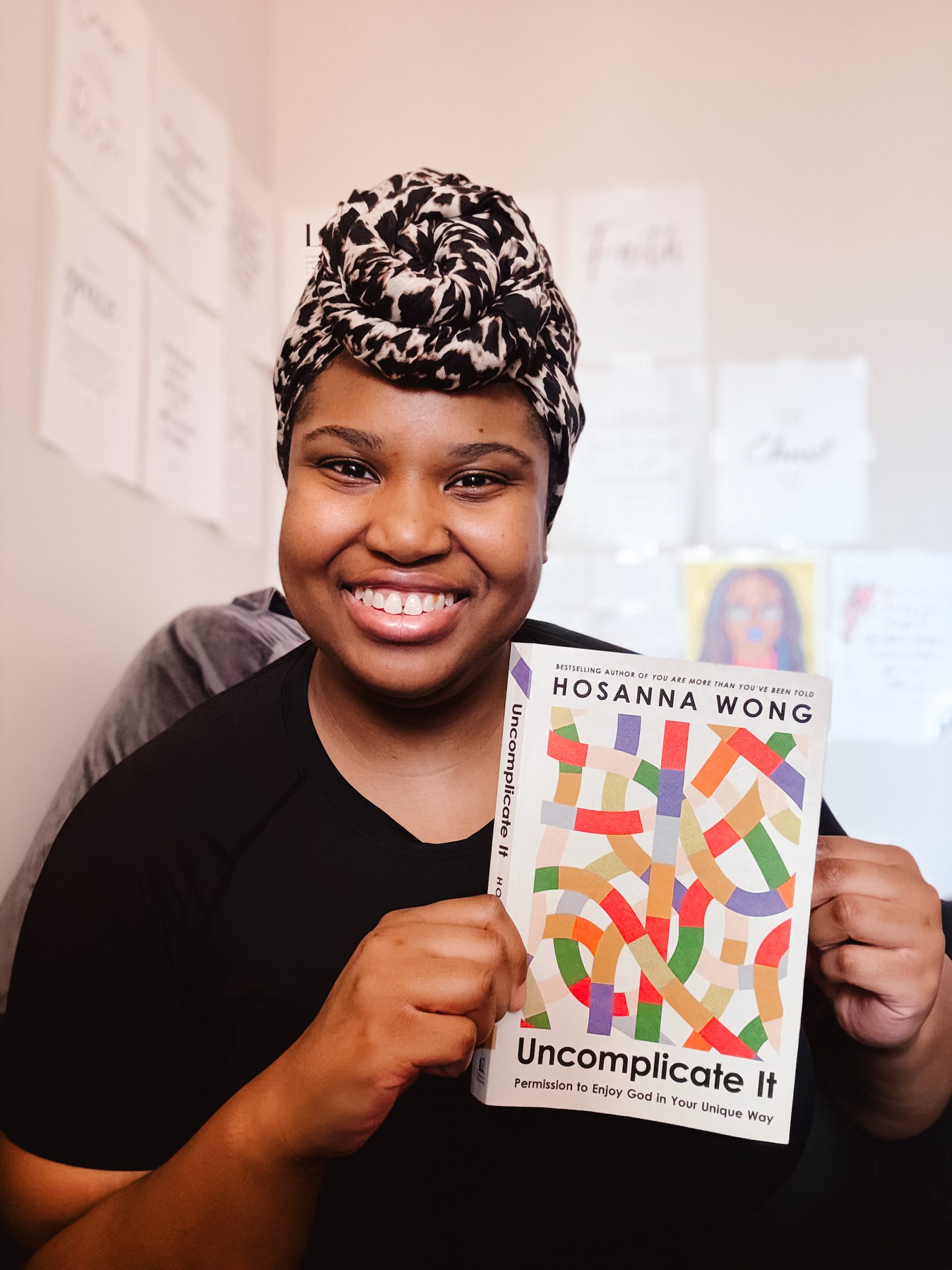 Book reviewer, Priscilla holding Uncomplicate It