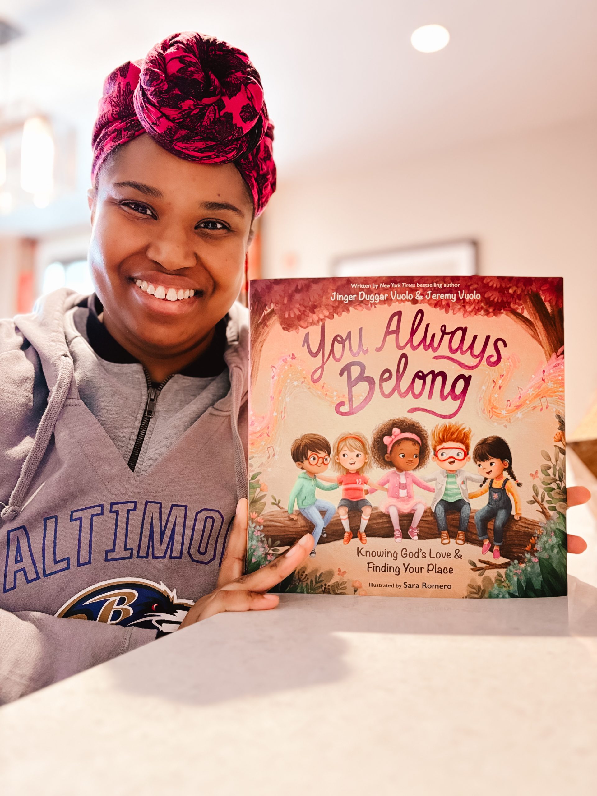 Book reviewer, Priscilla holding Uncomplicate It