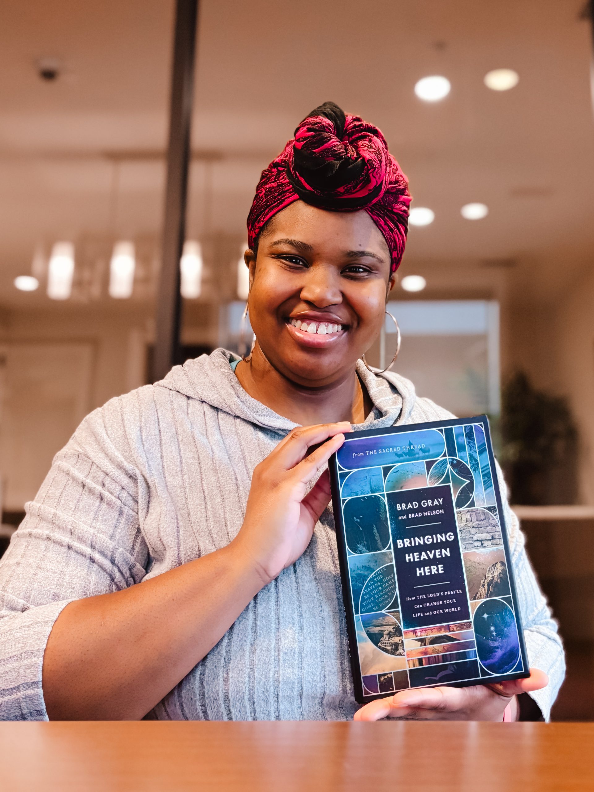 IMG_6741_jpg (1) Book reviewer, Priscilla holding Uncomplicate It